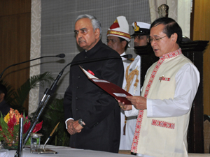 The Governor of Arunachal Pradesh Lt. Gen (Retd) Nirbhay Sharma administering the oath of office and secrecy  to Shri Nabum Tuki as the latter is being sworn-in as the Chief Minister at Darbar Hall, Raj Bhavan on 18th May 2014